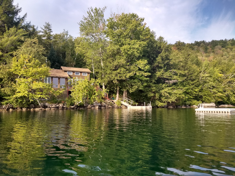 House, dock and raft from water