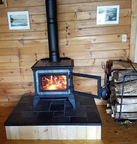 Wood burning soapstone stove in living room